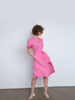 Series of studio photos of young female model in bright pink midi dress