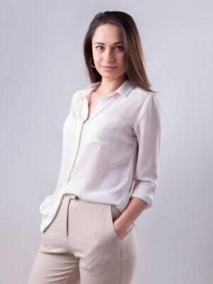 Young business girl is standing in the light